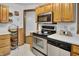 Practical kitchen features stainless steel appliances, light countertops, and wooden cabinetry, blending style and functionality at 241 Wehmeier St, Columbus, IN 47201