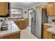 Efficient kitchen with stainless steel appliances, bright countertops, and ample natural light, a chef's delight at 241 Wehmeier St, Columbus, IN 47201