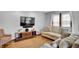 Cozy living room featuring hardwood floors, a comfortable sofa, and a modern entertainment center at 241 Wehmeier St, Columbus, IN 47201