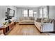 Bright living room with large windows, hardwood floors, and comfortable seating arrangements, perfect for relaxation at 241 Wehmeier St, Columbus, IN 47201