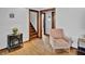 Inviting living room with classic design, hardwood floors, and a comfortable chair near a decorative fireplace at 241 Wehmeier St, Columbus, IN 47201