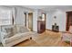 Well-lit living room with hardwood floors, comfortable sofa, and charming accents, creating a welcoming atmosphere at 241 Wehmeier St, Columbus, IN 47201