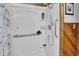 Walk-in shower with grab bar, showerhead, and shelves, with wood paneling at 241 Wehmeier St, Columbus, IN 47201