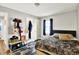 Bedroom featuring a comfortable bed, with storage options, and a closet at 26 E Plum St, Anderson, IN 46012