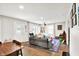 Spacious living room with a projector, musical instruments, and dining area at 26 E Plum St, Anderson, IN 46012