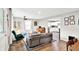 Open concept living room showcasing guitars on wall with kitchen view at 26 E Plum St, Anderson, IN 46012
