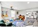 Well-lit living area with musical instruments and an open layout to the kitchen at 26 E Plum St, Anderson, IN 46012
