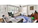 Open-concept living room with natural light, musical instruments and cozy furniture at 26 E Plum St, Anderson, IN 46012