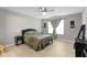 Comfortable bedroom featuring a ceiling fan, neutral walls, and bright natural lighting at 2733 Lamar Dr, Whitestown, IN 46075