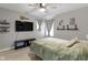 Cozy bedroom with a ceiling fan, mounted TV, and soothing gray walls at 2733 Lamar Dr, Whitestown, IN 46075