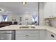 Close-up of stainless steel sink and modern countertop with view to living room at 2733 Lamar Dr, Whitestown, IN 46075