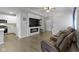Inviting living room with a modern fireplace and a view into the stylish, updated kitchen at 2733 Lamar Dr, Whitestown, IN 46075