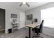 Functional home office with a standing desk setup and ample natural light from the window at 2733 Lamar Dr, Whitestown, IN 46075