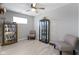 Well-lit room with laminate flooring, neutral walls, and decorative display cabinets at 2733 Lamar Dr, Whitestown, IN 46075