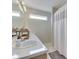 Bathroom featuring double sink vanity, sleek lighting, neutral wall color and shower with curtain at 2734 Newaygo Dr, Indianapolis, IN 46217