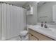 Cozy bathroom with a functional layout, including a toilet, sink, and shower with a curtain at 2734 Newaygo Dr, Indianapolis, IN 46217