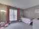 Bright bedroom with a bed and a window at 2734 Newaygo Dr, Indianapolis, IN 46217