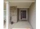 Inviting front porch with a stylish black door, brick accents, and space for outdoor seating at 2734 Newaygo Dr, Indianapolis, IN 46217