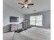 The primary bedroom offers carpet flooring, a ceiling fan, neutral tones, and plenty of natural light at 2734 Newaygo Dr, Indianapolis, IN 46217