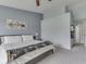 The cozy main bedroom includes a ceiling fan, carpet flooring, and an ensuite bathroom at 2734 Newaygo Dr, Indianapolis, IN 46217