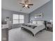 The spacious main bedroom includes carpet flooring, a ceiling fan, and neutral paint tones at 2734 Newaygo Dr, Indianapolis, IN 46217