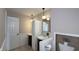 Tastefully decorated bathroom with tiled floors, lovely vanity, and well-placed lighting at 3019 E Berwyn St, Indianapolis, IN 46203