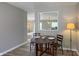 Bright dining area with a wooden table set for two and views to the living room at 3019 E Berwyn St, Indianapolis, IN 46203