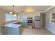 Charming kitchen featuring stainless steel appliances, light countertops, and lovely two-tone cabinets at 3019 E Berwyn St, Indianapolis, IN 46203