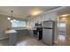 Well-lit kitchen with stainless appliances and pleasing two-tone cabinets at 3019 E Berwyn St, Indianapolis, IN 46203