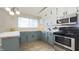 Updated kitchen with butcher block counters and stainless appliances at 3019 E Berwyn St, Indianapolis, IN 46203