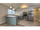 Bright kitchen with ample natural light, stainless steel appliances, and attractive cabinets at 3019 E Berwyn St, Indianapolis, IN 46203