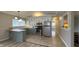 The updated kitchen has stainless appliances, butcher block countertops, and modern lighting at 3019 E Berwyn St, Indianapolis, IN 46203