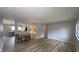 Open-concept living and dining room with wood-look flooring and neutral paint at 3019 E Berwyn St, Indianapolis, IN 46203