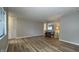 Spacious living room with wood-look flooring, neutral paint, and natural light at 3019 E Berwyn St, Indianapolis, IN 46203