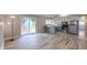 Open floor plan with modern kitchen and sliding glass doors leading to outdoor space at 3019 E Berwyn St, Indianapolis, IN 46203