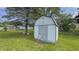 Outdoor shed with a quaint, rustic design, surrounded by a lush, green lawn at 3019 E Berwyn St, Indianapolis, IN 46203