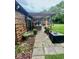 Relaxing backyard patio with a pergola, outdoor furniture, and beautiful potted plants at 3130 Taylor Rd, Columbus, IN 47203