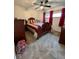 Cozy bedroom with natural light, ceiling fan, and hardwood furniture at 3130 Taylor Rd, Columbus, IN 47203