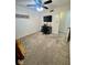 Bright bedroom with TV, ceiling fan, and neutral-toned walls at 3130 Taylor Rd, Columbus, IN 47203