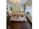 Traditional dining room with hardwood floors, a large window and a decorative light fixture at 3130 Taylor Rd, Columbus, IN 47203