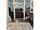 Foyer featuring decorative accents leading to a living room with cozy furniture and a ceiling fan at 3130 Taylor Rd, Columbus, IN 47203
