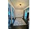 Front foyer with decorative wrought iron accents and a view into adjacent rooms at 3130 Taylor Rd, Columbus, IN 47203
