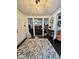 A cozy foyer features a decorative rug, tiled floors, and iron design elements at 3130 Taylor Rd, Columbus, IN 47203