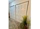Hallway features dual closets and a potted plant at 3130 Taylor Rd, Columbus, IN 47203