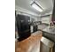 Modern kitchen featuring gray cabinets, granite counters, and stainless steel appliances at 3130 Taylor Rd, Columbus, IN 47203