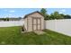 Backyard shed with garden beds offering extra storage and gardening space at 317 Virginia St, Fortville, IN 46040