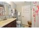 Cozy bathroom featuring a single sink, vanity, and floral shower curtain at 317 Virginia St, Fortville, IN 46040