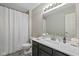 Bright bathroom with gray vanity, white sink, and shower featuring updated fixtures and modern finishes at 317 Virginia St, Fortville, IN 46040