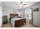 Relaxing bedroom with a large window providing natural light and wood furniture providing a cozy retreat at 317 Virginia St, Fortville, IN 46040