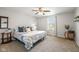 Cozy bedroom featuring a comfortable bed, ceiling fan, and natural light at 317 Virginia St, Fortville, IN 46040